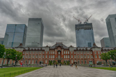 Buildings in city against sky