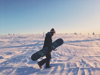 Full length of person skiing on snow covered landscape