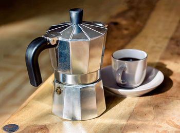 Close-up of coffee cup on table