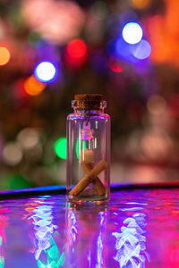 Close-up of illuminated light painting on table