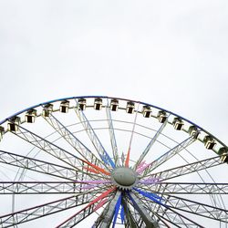 Low angle view of ferris wheel against sky