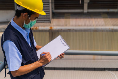 Man working on mobile phone