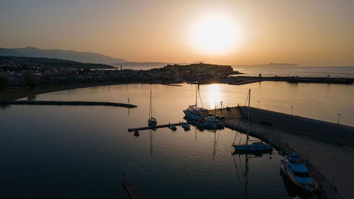 View of harbor at sunset