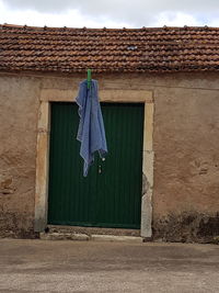 Clothes drying outside house