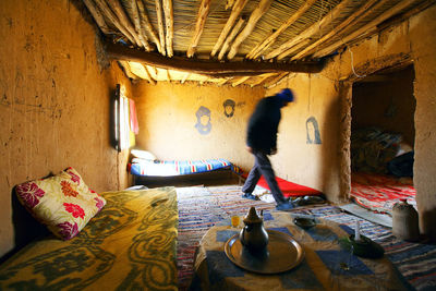 Man in built structure in desert