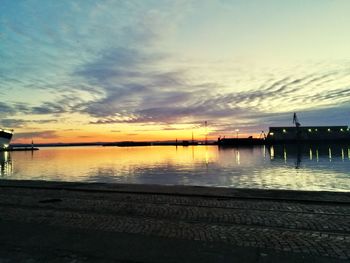 Scenic view of lake against sky during sunset