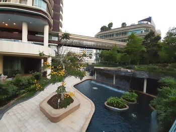 View of swimming pool by building against sky