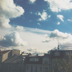 Low angle view of built structure against cloudy sky