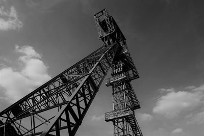 Low angle view of rollercoaster against sky