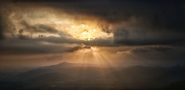 Scenic view of cloudy sky at sunset