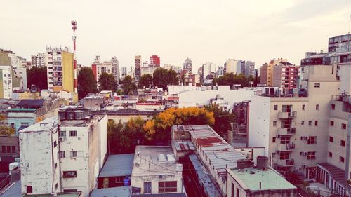 High angle view of buildings in city against sky