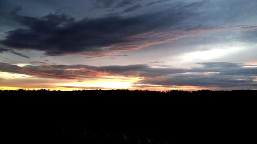 Silhouette of landscape against dramatic sky