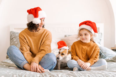 Merry christmas and happy new year. happy family with dog jack russell are