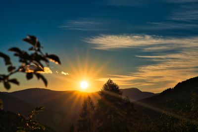 Scenic view of silhouette mountains against sky during sunset