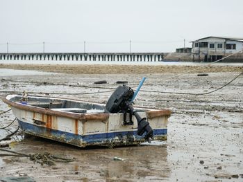 Nautical vessel on sea shore against sky