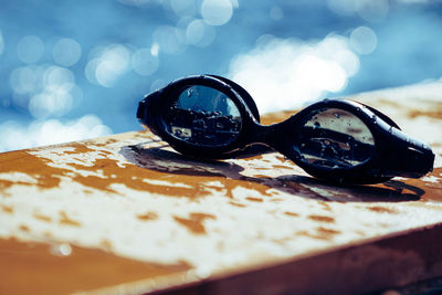 Close-up of swimming goggles on table