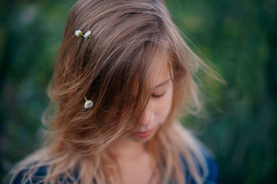 Close-up of young woman looking away