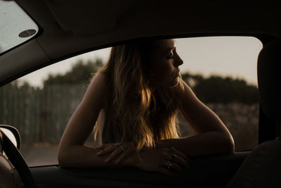 Woman sitting in car