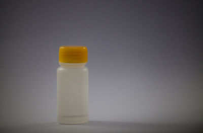 Close-up of glass bottle on table