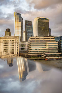 Modern buildings against sky in city