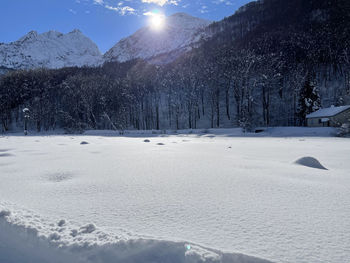 Scenic view of snow covered mountains against sky