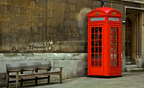 Red telephone booth on street