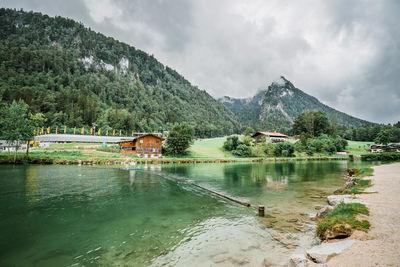 Scenic view of lake and mountains against sky