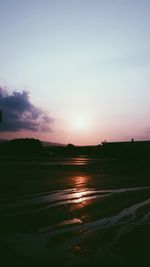 Scenic view of silhouette landscape against sky during sunset