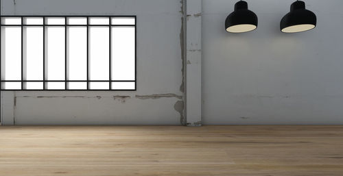 Illuminated pendant lights hanging in room