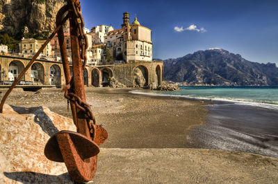 Historic building by sea against sky