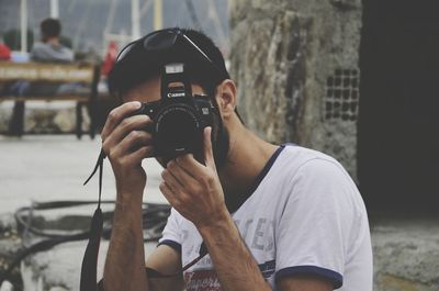Man photographing camera