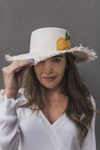 Portrait of beautiful hispanic woman with a hat