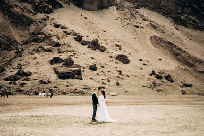 Couple standing in a desert