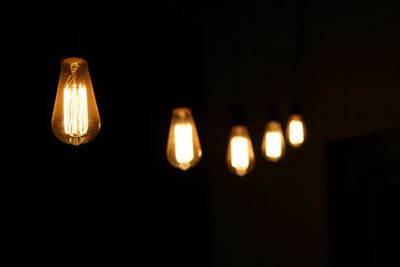 Close-up of lit light bulb