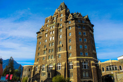 Low angle view of buildings against blue sky