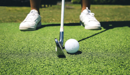 Low section of man playing golf