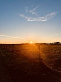 Scenic view of landscape against sky during sunset