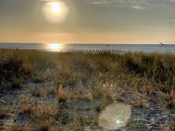 Scenic view of sea against sky during sunset
