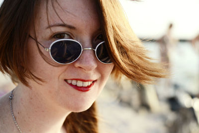 Portrait of young woman wearing sunglasses