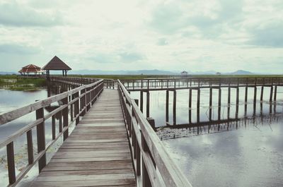 Pier over sea against sky