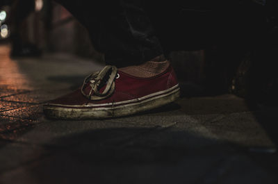 Low section of man standing on floor