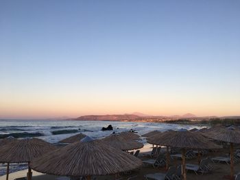 Scenic view of sea against clear sky during sunset