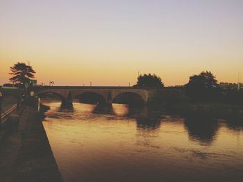 Silhouette of bridge over river
