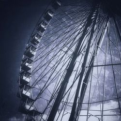 Low angle view of ferris wheel against sky