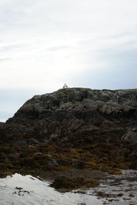 Rock formation on land against sky