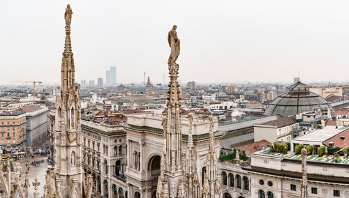 Panoramic view of buildings in city against clear sky