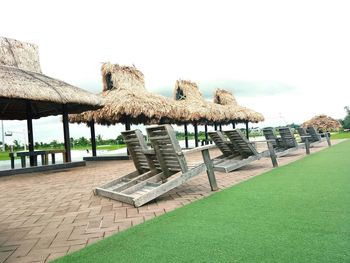 Chairs and tables against clear sky