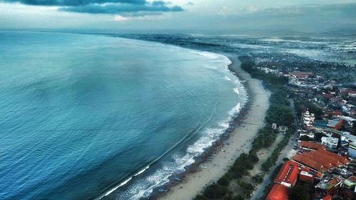 High angle view of sea and buildings against sky