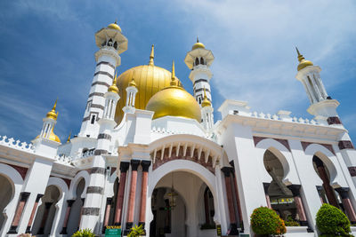 Low angle view of mosque against sky