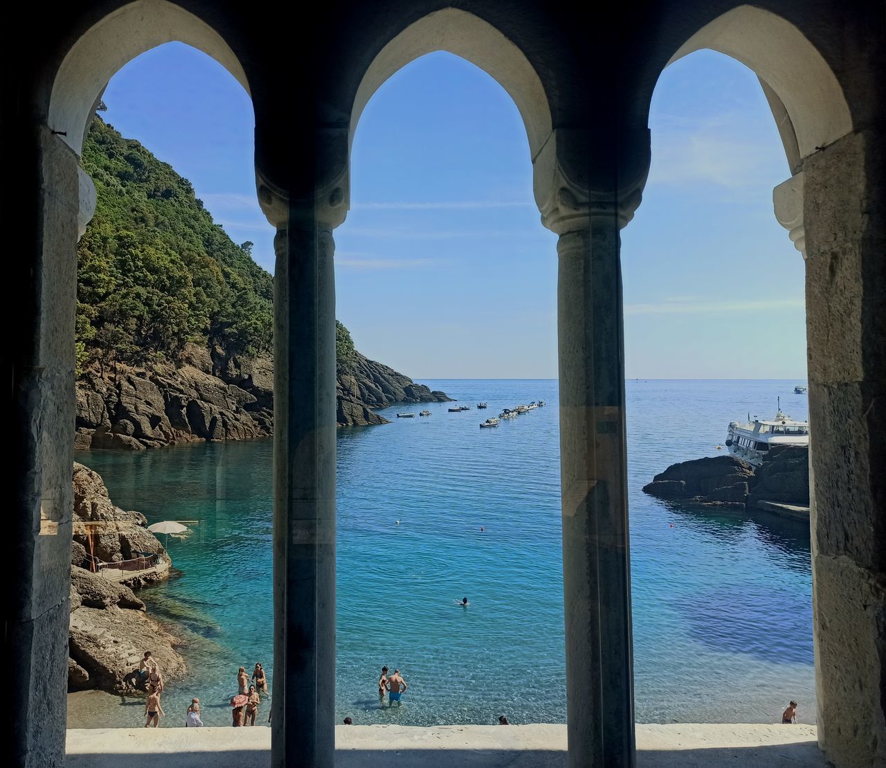 SCENIC VIEW OF SEA SEEN THROUGH ARCH